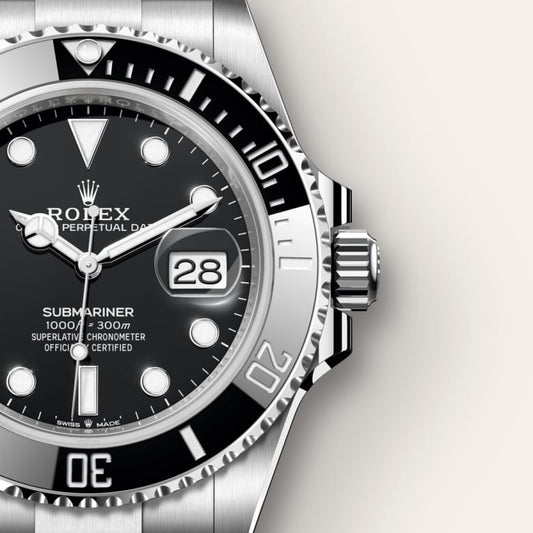 Close-up of a Rolex watch with black dial and silver case on a white  background  - Dreams Pakistan